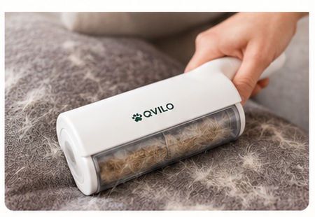 OQVILO reusable self-cleaning pet hair remover on a fabric sofa